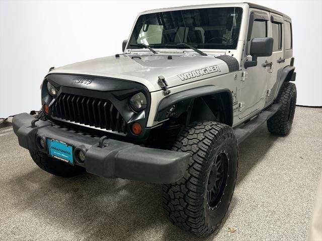 used 2011 Jeep Wrangler Unlimited car, priced at $13,492