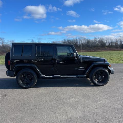 used 2011 Jeep Wrangler Unlimited car, priced at $12,995