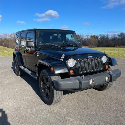 used 2011 Jeep Wrangler Unlimited car, priced at $12,995