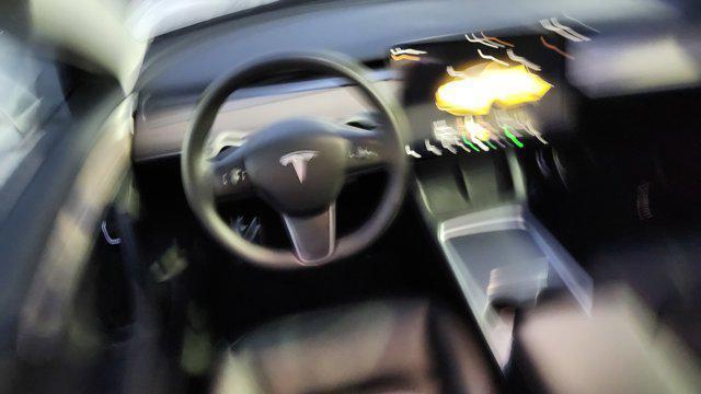 used 2023 Tesla Model 3 car, priced at $22,700