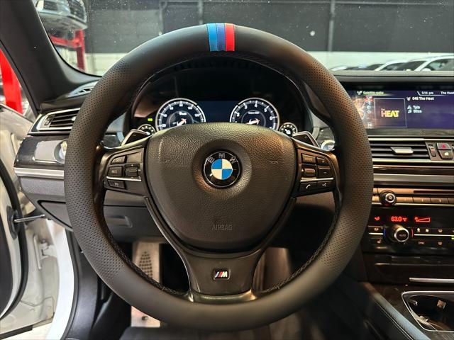 used 2014 BMW 750 car, priced at $13,990