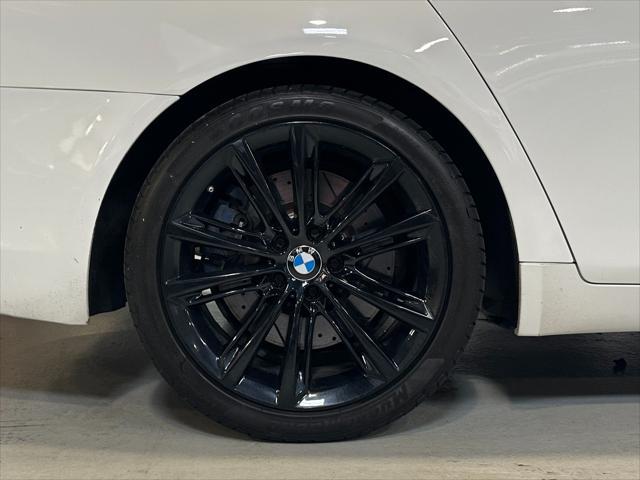 used 2014 BMW 750 car, priced at $13,990