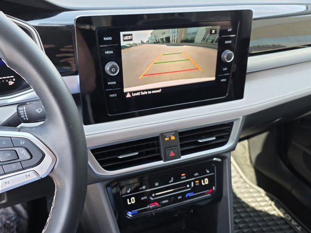 used 2025 Volkswagen Taos car, priced at $25,995