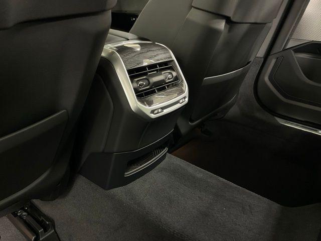 new 2025 BMW 740 car, priced at $104,055