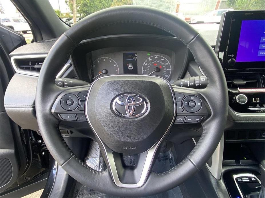 used 2024 Toyota Corolla Cross Hybrid car, priced at $32,988