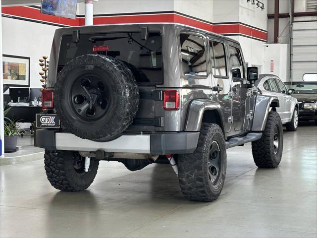 used 2014 Jeep Wrangler Unlimited car, priced at $18,997