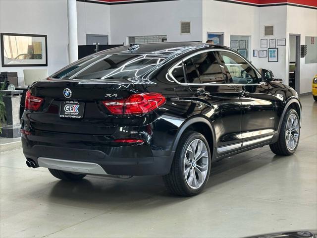 used 2018 BMW X4 car, priced at $19,997