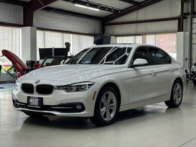 used 2018 BMW 330 car, priced at $19,497