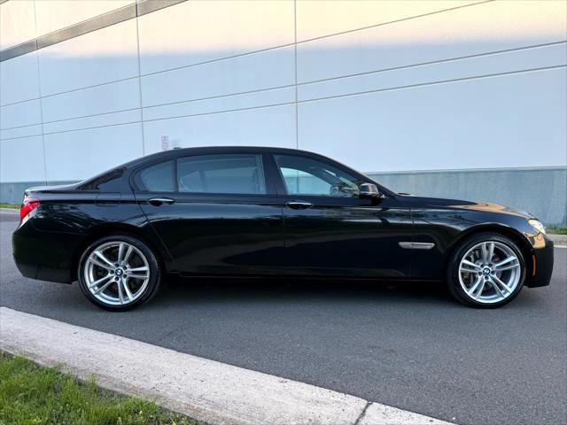 used 2014 BMW 750 car, priced at $15,499