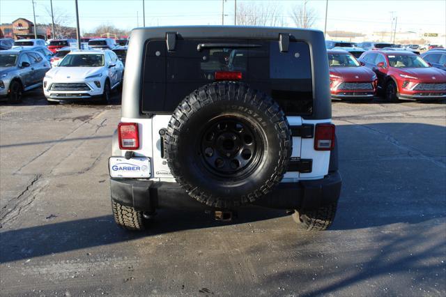 used 2013 Jeep Wrangler Unlimited car, priced at $14,696