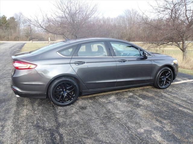 used 2016 Ford Fusion car, priced at $4,995