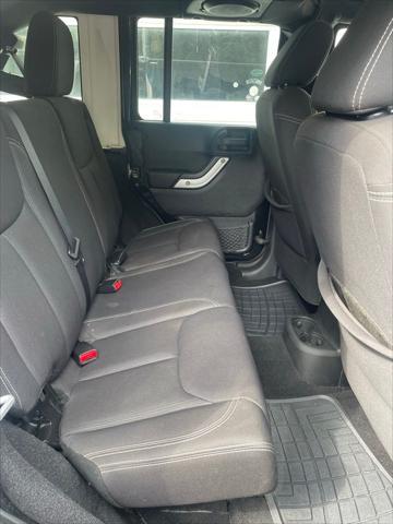 used 2013 Jeep Wrangler Unlimited car, priced at $15,652