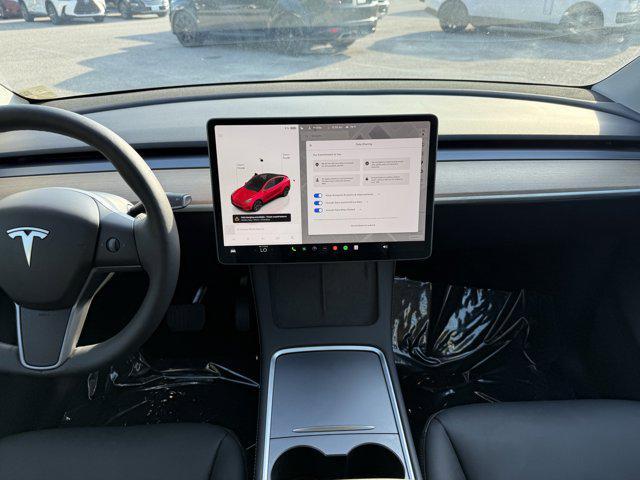 used 2024 Tesla Model Y car, priced at $34,441