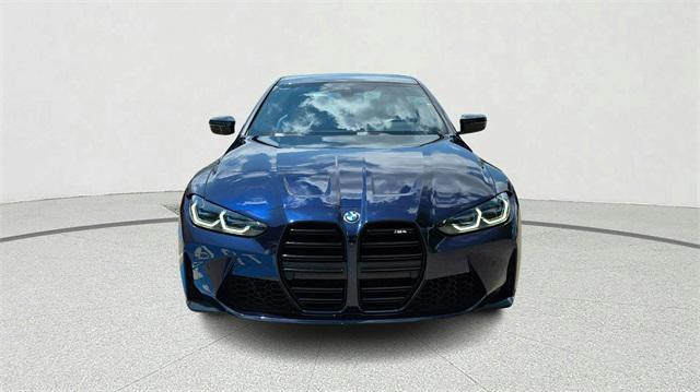 used 2022 BMW M4 car, priced at $57,900