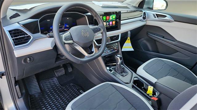 used 2025 Volkswagen Taos car, priced at $28,000