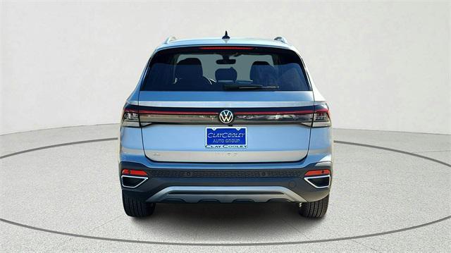 used 2025 Volkswagen Taos car, priced at $28,000