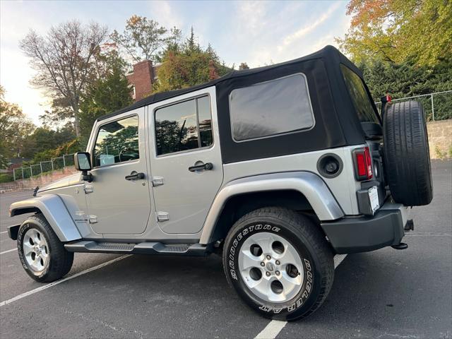 used 2014 Jeep Wrangler Unlimited car, priced at $14,495