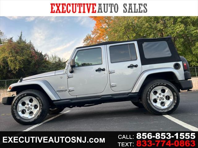 used 2014 Jeep Wrangler Unlimited car, priced at $14,495