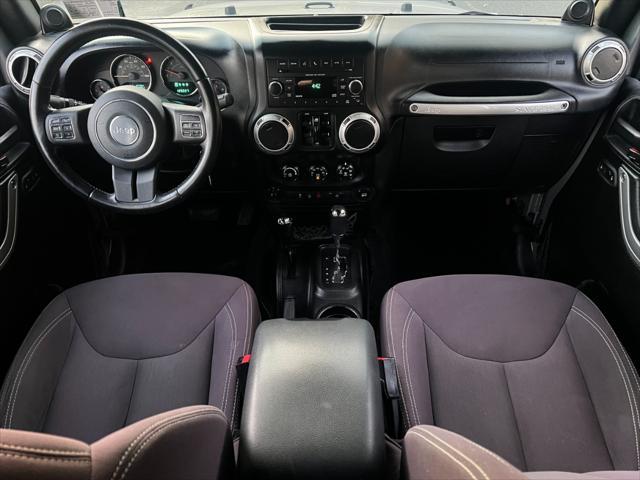 used 2014 Jeep Wrangler Unlimited car, priced at $14,495