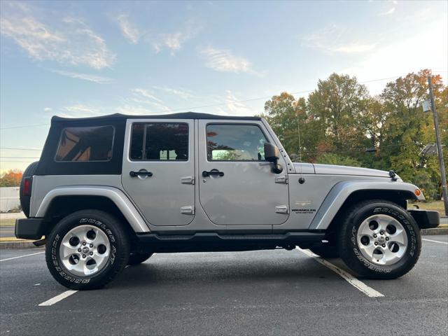 used 2014 Jeep Wrangler Unlimited car, priced at $14,495