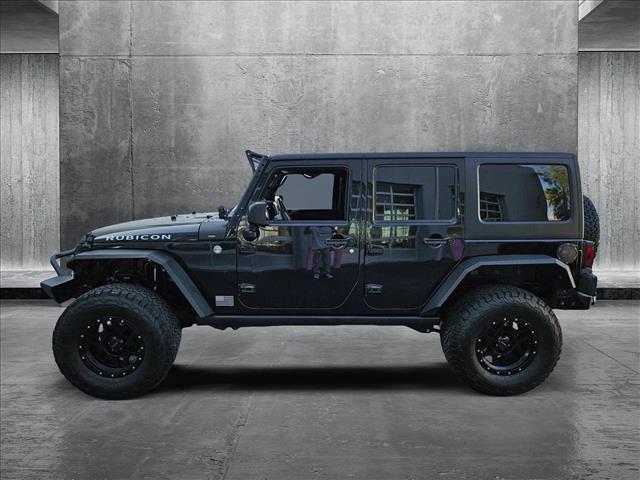 used 2014 Jeep Wrangler Unlimited car, priced at $24,179