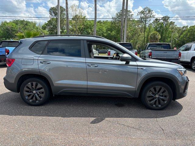 used 2023 Volkswagen Taos car, priced at $18,000