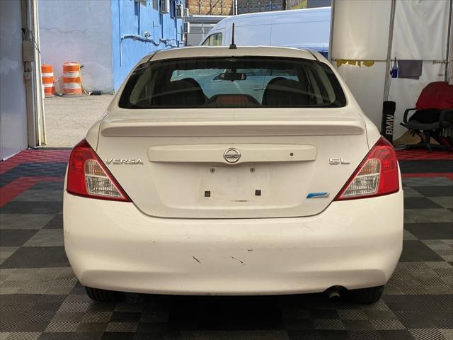 used 2012 Nissan Versa car, priced at $5,995