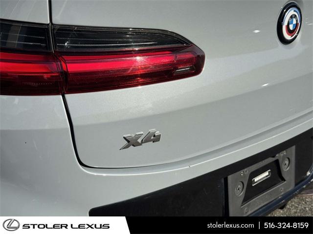 used 2023 BMW X4 car, priced at $50,000