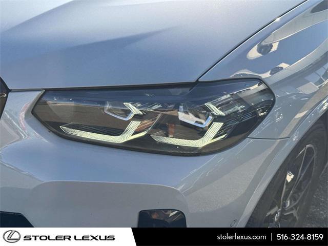 used 2023 BMW X4 car, priced at $50,000