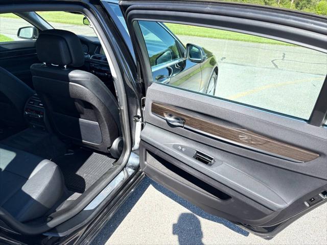 used 2015 BMW 750 car, priced at $16,999