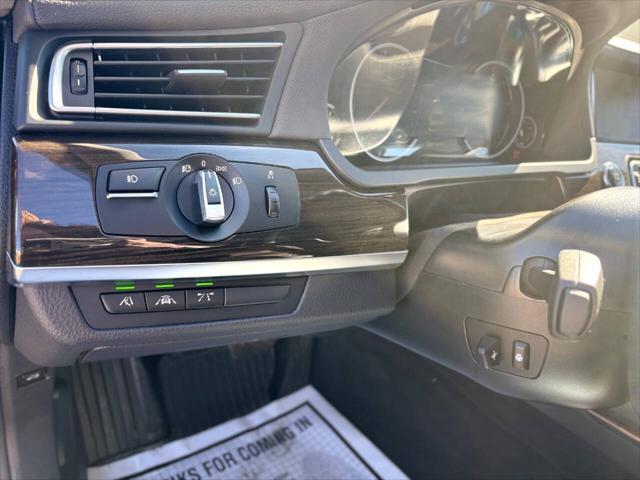 used 2015 BMW 750 car, priced at $17,999