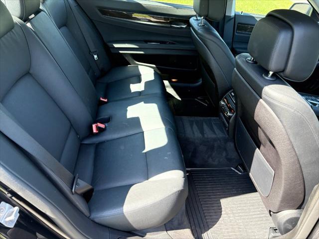 used 2015 BMW 750 car, priced at $16,999