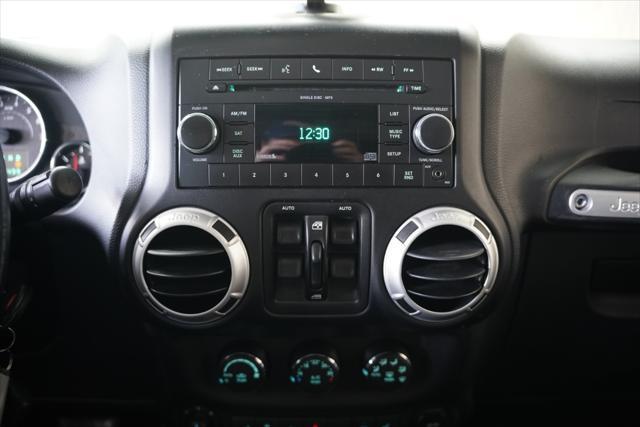 used 2011 Jeep Wrangler Unlimited car, priced at $14,275