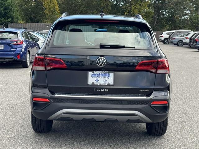 used 2023 Volkswagen Taos car, priced at $23,186