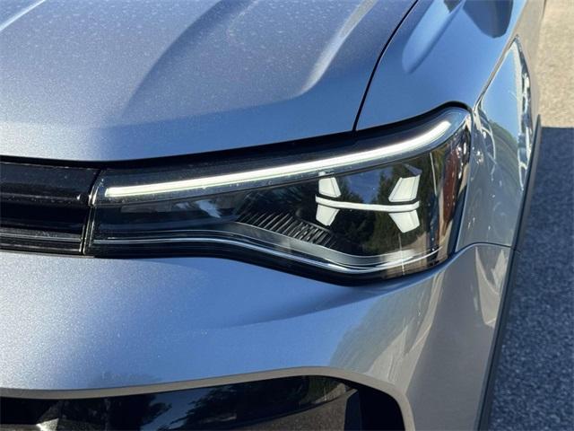 used 2025 Volkswagen Taos car, priced at $27,522