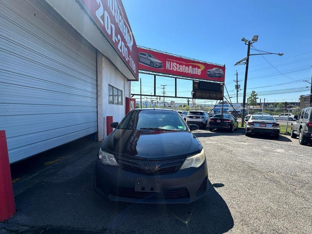used 2014 Toyota Camry car, priced at $4,600