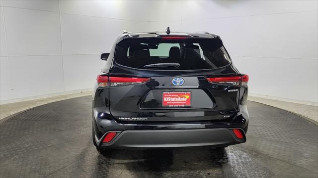 used 2021 Toyota Highlander Hybrid car, priced at $30,150