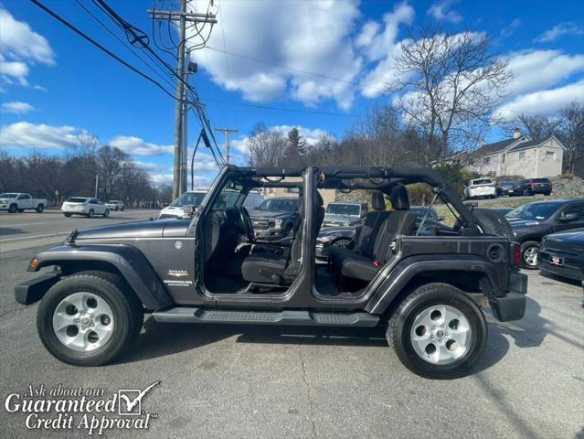 used 2014 Jeep Wrangler Unlimited car, priced at $16,495