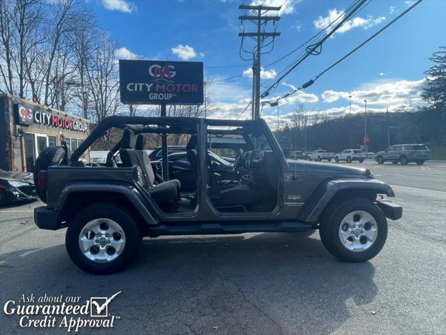 used 2014 Jeep Wrangler Unlimited car, priced at $16,495