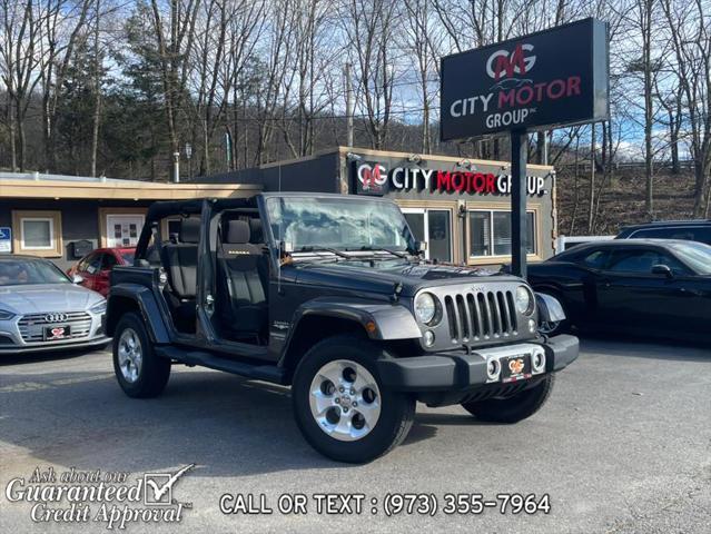 used 2014 Jeep Wrangler Unlimited car, priced at $16,495