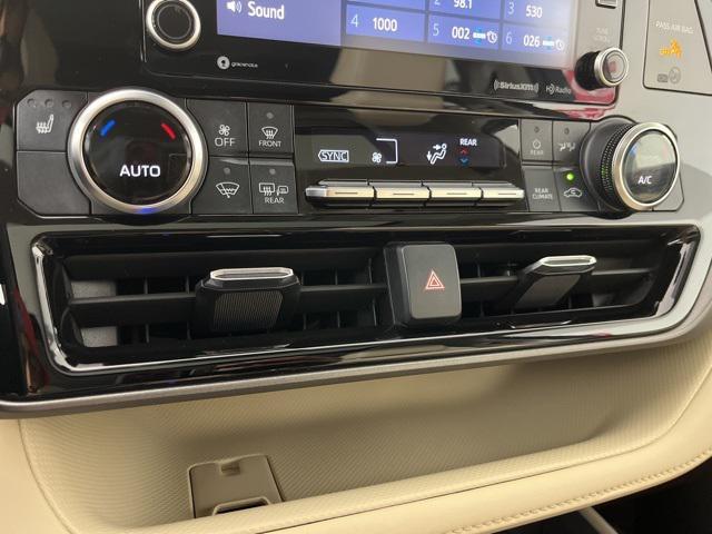 used 2022 Toyota Highlander Hybrid car, priced at $31,464