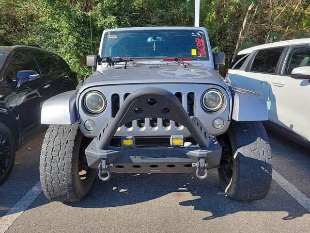 used 2014 Jeep Wrangler Unlimited car, priced at $17,416