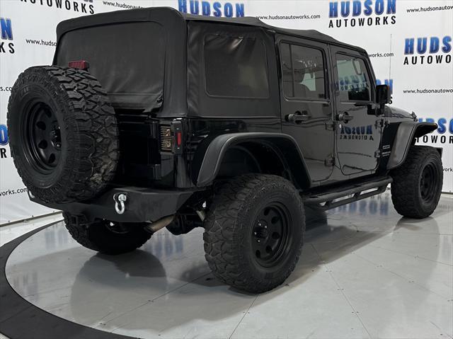 used 2014 Jeep Wrangler Unlimited car, priced at $15,393