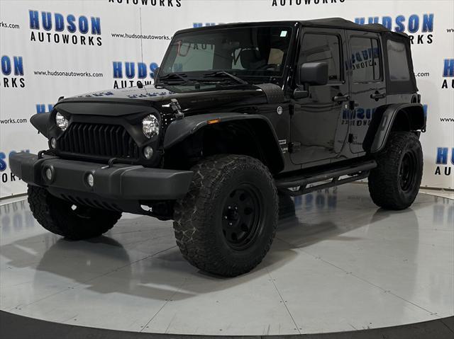used 2014 Jeep Wrangler Unlimited car, priced at $15,393