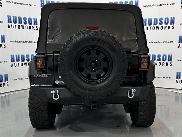 used 2014 Jeep Wrangler Unlimited car, priced at $15,393