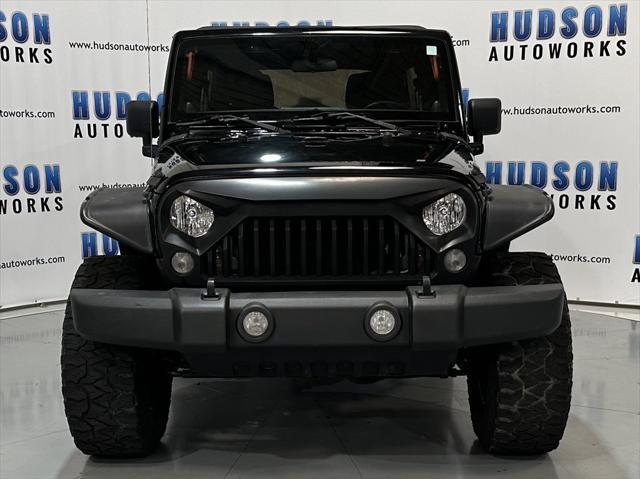 used 2014 Jeep Wrangler Unlimited car, priced at $15,393