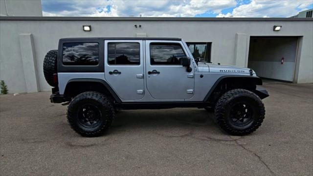 used 2014 Jeep Wrangler Unlimited car, priced at $25,998