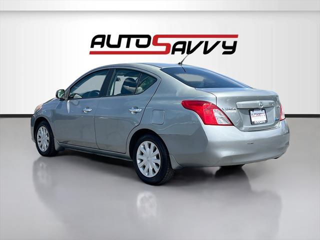 used 2014 Nissan Versa car, priced at $7,500