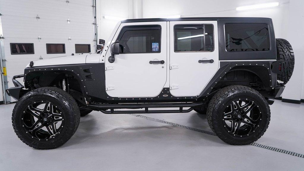 used 2015 Jeep Wrangler Unlimited car, priced at $21,488