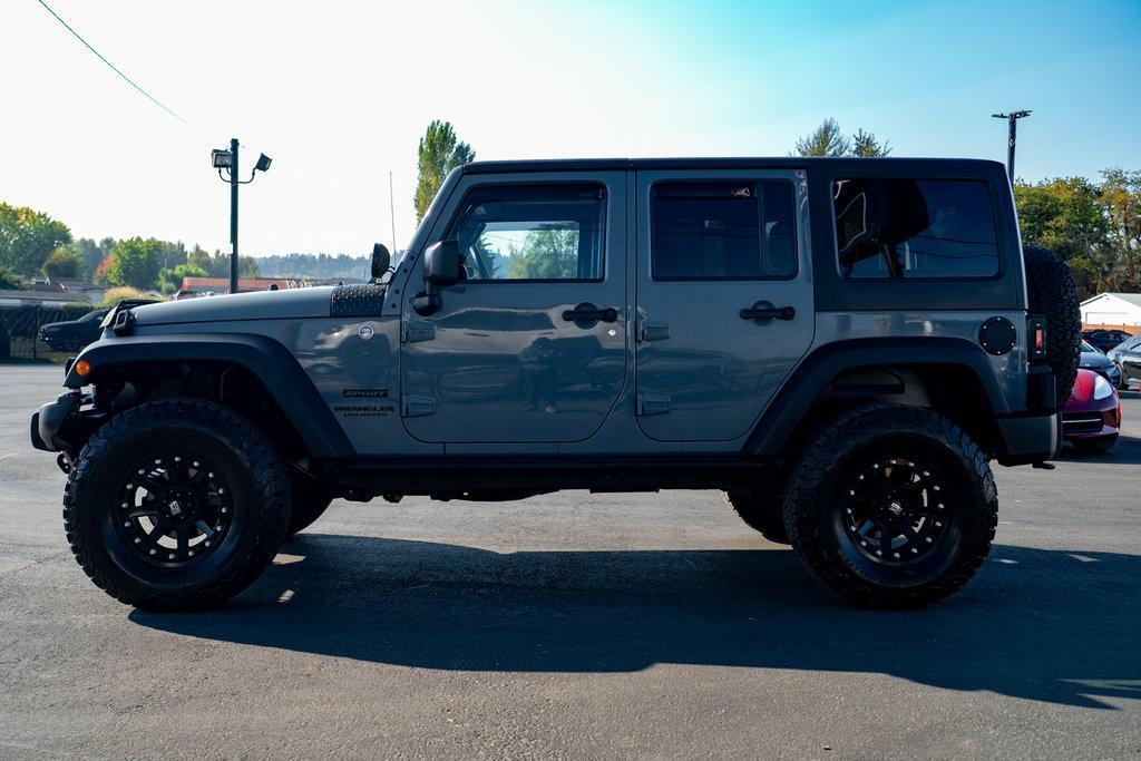 used 2014 Jeep Wrangler Unlimited car, priced at $21,697